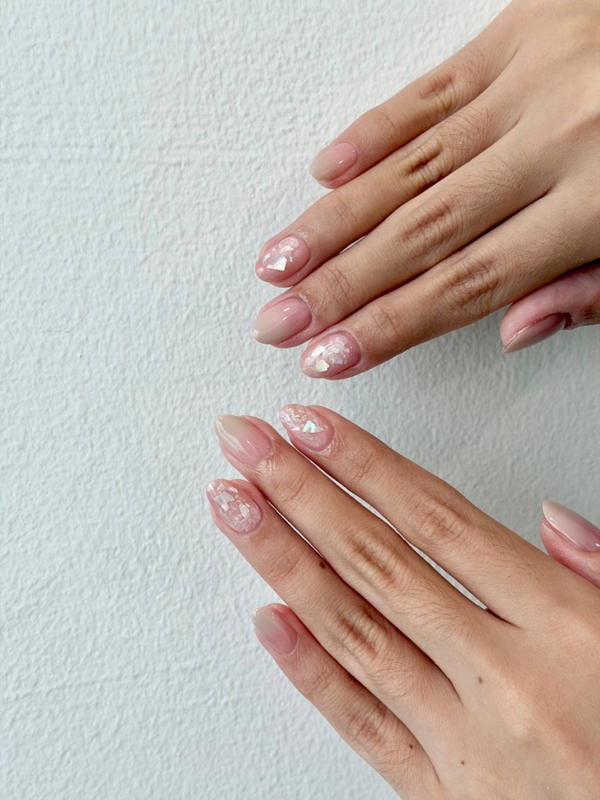 Long pale pink almond nails